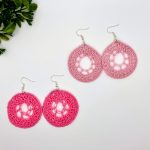 Crochet dream catcher earrings, on the left dark pink, and on the right light pink