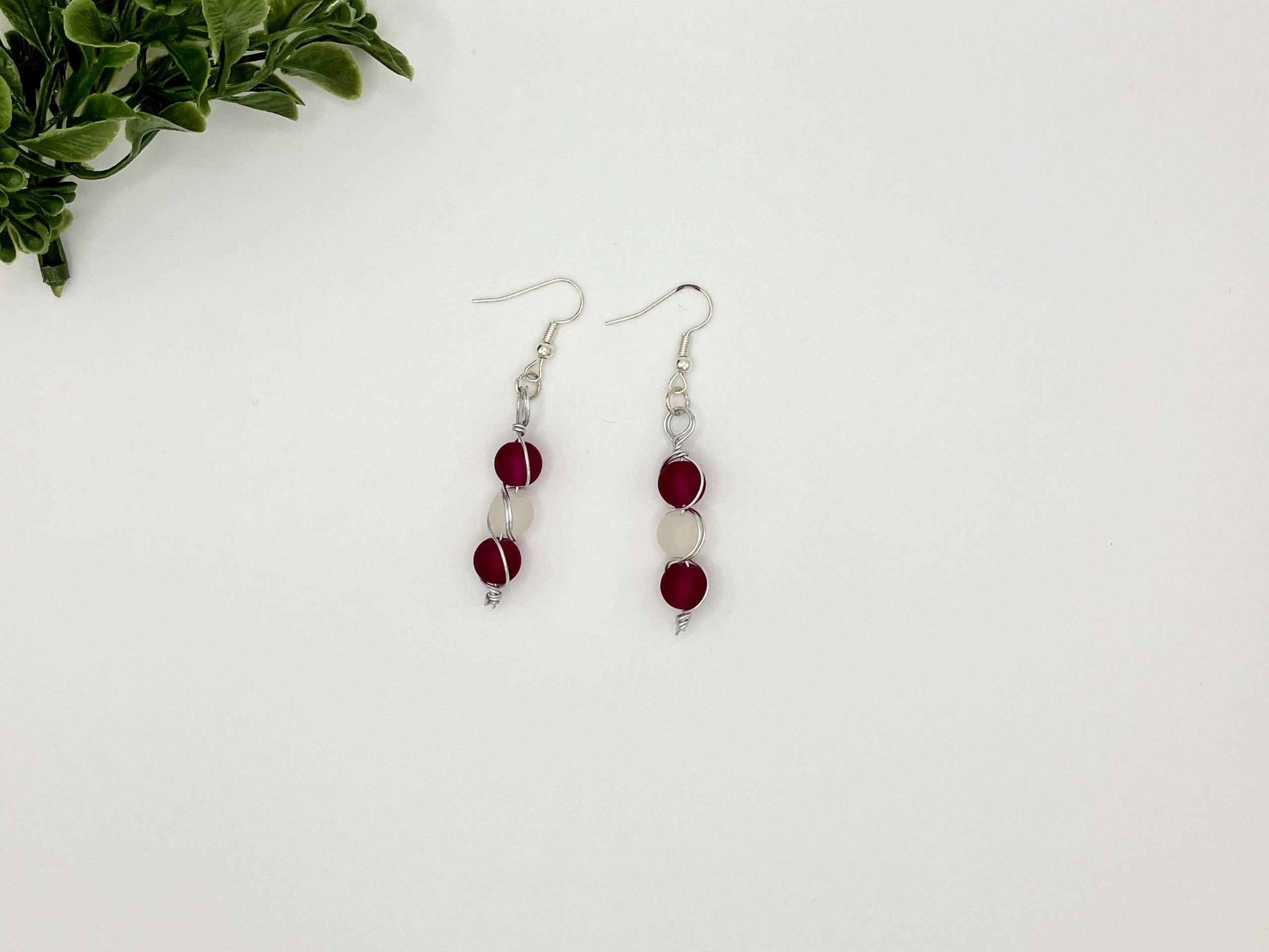 Pair of beaded red and white dangle earrings
