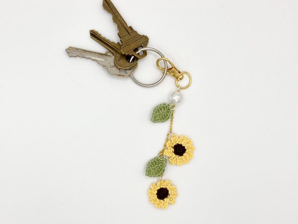 Crochet sunflower bag charm on a set of keys