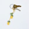 Crocheted pineapple keychain on a key ring with keys