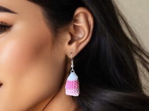 Close up of woman wearing crochet candy corn dangle earrings