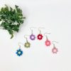 Mini flower earrings in blue, green, purple, red, dark pink, and light pink displayed against a white background