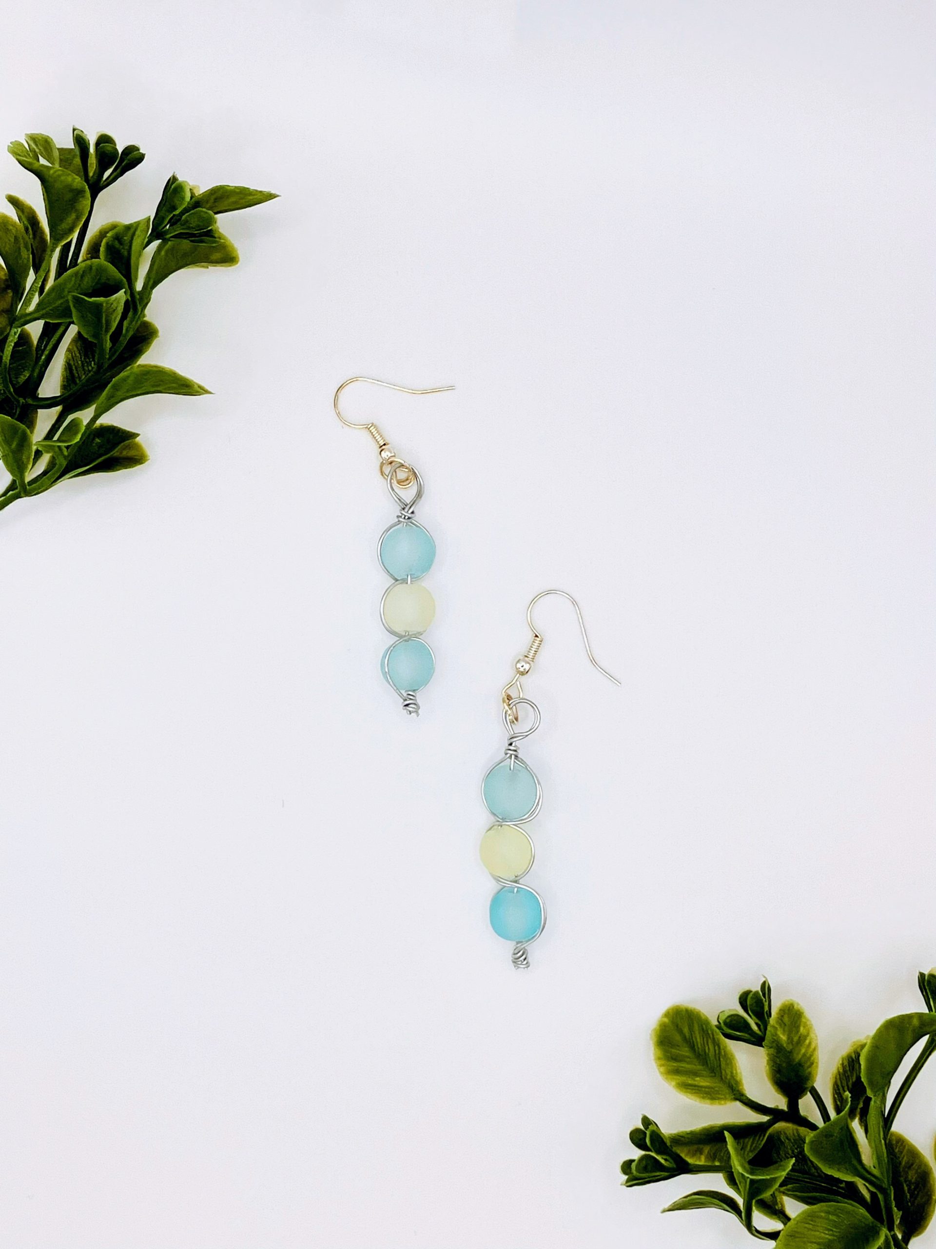 Sea blue and white beaded dangle earrings