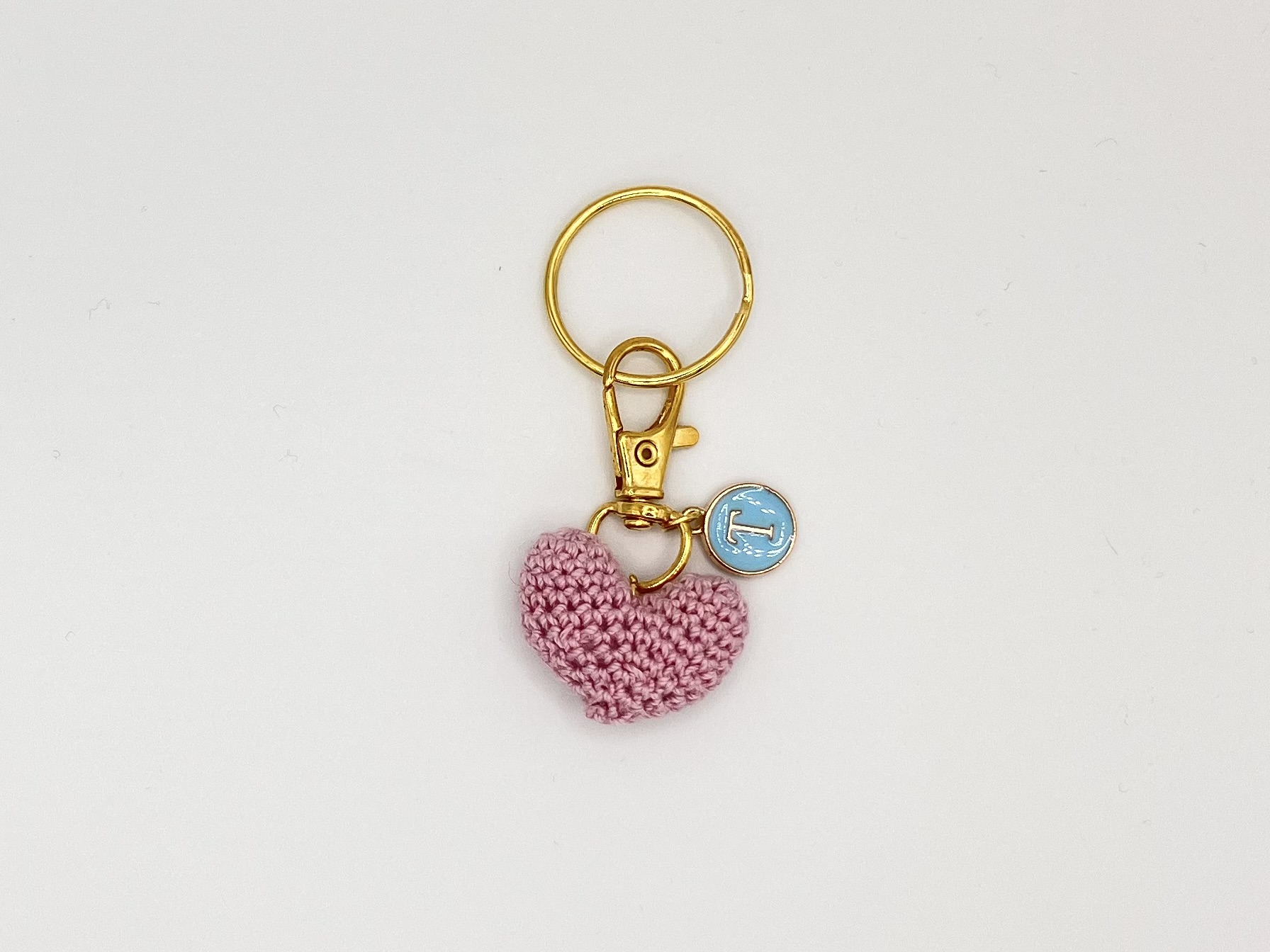 IMG_2993 Handmade pink crochet heart, on a gold key ring, with a blue and gold letter charm