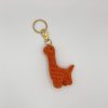 Orange crochet dinosaur keychain