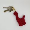 Red crochet dinosaur keychain