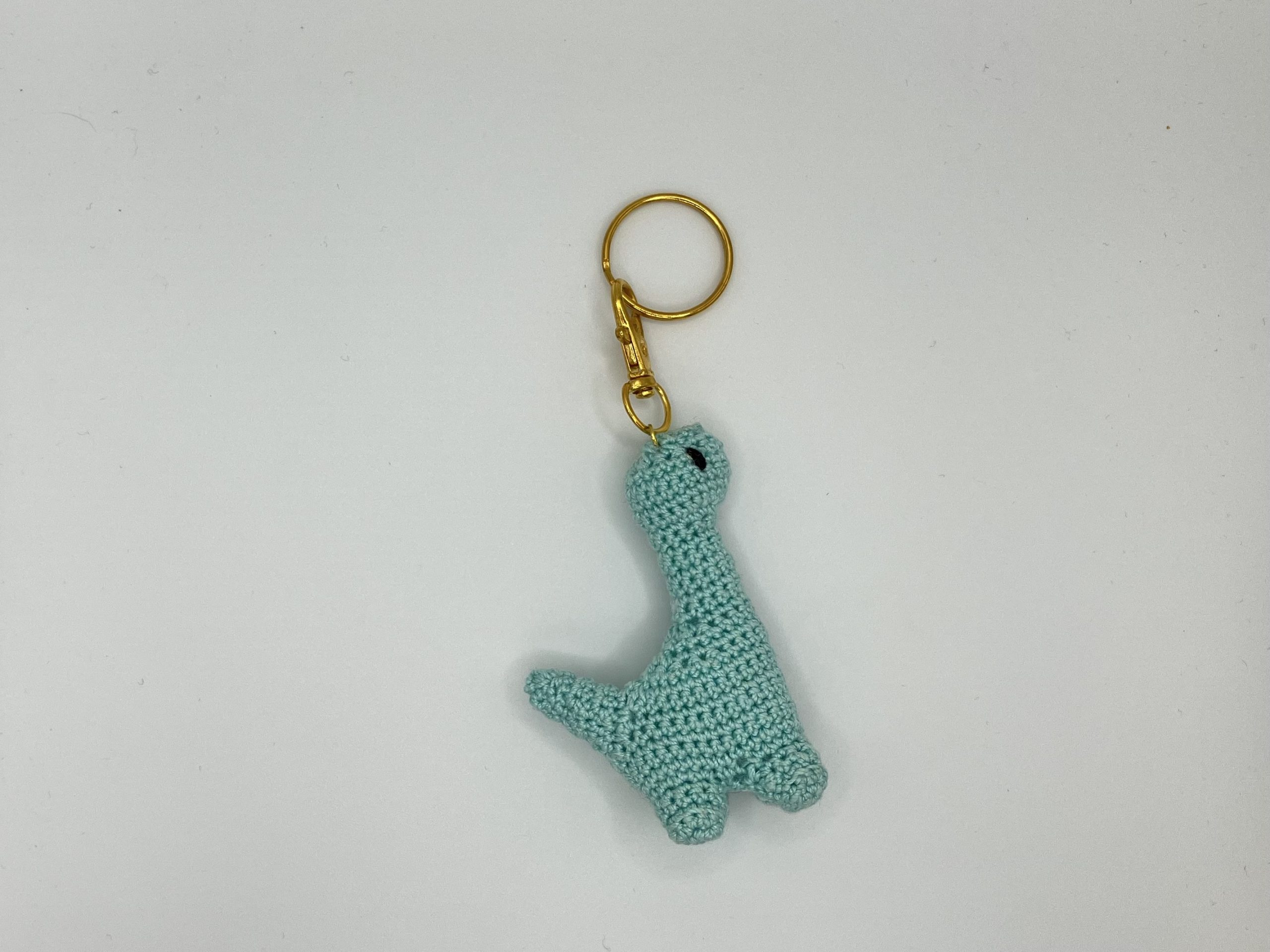Blue mini crochet dinosaur keychain